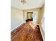 Bright living room with hardwood floors and large windows providing natural light at 428 E Orange Ave, Eustis, FL 32726