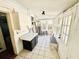 Sunroom with white tile floors, lots of windows and a door to outside at 428 E Orange Ave, Eustis, FL 32726
