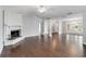 Spacious living room with hardwood floors, fireplace, and chandelier at 526 Thames Cir, Longwood, FL 32750