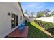 Cozy backyard with brick patio and patio set, perfect for enjoying the outdoors at 702 Barrington Cir, Winter Springs, FL 32708