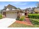 Charming single-Gathering home with a brick facade and a two-car garage in a well manicured neighborhood at 702 Barrington Cir, Winter Springs, FL 32708