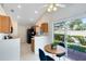 Bright eat-in kitchen with a breakfast table, stainless appliances, and backyard access at 702 Barrington Cir, Winter Springs, FL 32708