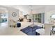 Bright living room with a modern fireplace, a ceiling fan, and sliding glass doors to the outside at 702 Barrington Cir, Winter Springs, FL 32708