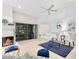 Comfortable living area with a fireplace, patio access, and stylish decor at 702 Barrington Cir, Winter Springs, FL 32708