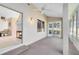 Enclosed sunroom with carpet flooring, a ceiling fan, and a view of the yard at 702 Barrington Cir, Winter Springs, FL 32708