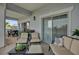 Comfortable balcony seating area featuring a sofa, chairs, ottoman, and a view of palm trees at 7613 Cabana Ct # 402, Reunion, FL 34747