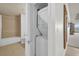 Cozy bathroom and stacked washer/dryer near the hall at 7613 Cabana Ct # 402, Reunion, FL 34747