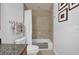 This cozy bathroom has a shower and tub at 7613 Cabana Ct # 402, Reunion, FL 34747