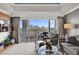 Comfortable living room with neutral tones and balcony access at 7613 Cabana Ct # 402, Reunion, FL 34747