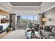 Cozy living room with balcony, perfect for relaxing and enjoying the view at 7613 Cabana Ct # 402, Reunion, FL 34747