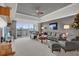 Spacious living room with comfortable seating and scenic balcony views at 7613 Cabana Ct # 402, Reunion, FL 34747