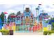 Playful resort water park with slides, splash zones, and a bucket dump creating an engaging Gathering-friendly environment at 7613 Cabana Ct # 402, Reunion, FL 34747
