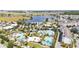 Stunning aerial view showcases community amenities like resort style pools, lush landscaping, and nearby lake at 7845 Dausset St, Orlando, FL 32827