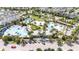 Overhead shot of a beautiful resort style pool with lounge areas, parking, lush landscaping and palm trees at 7845 Dausset St, Orlando, FL 32827