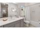 Bright bathroom featuring white subway tile in the shower and a single vanity sink at 7845 Dausset St, Orlando, FL 32827