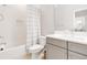 Bright bathroom featuring tile flooring, subway tiled shower, and a shower curtain at 7845 Dausset St, Orlando, FL 32827
