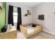 Cozy bedroom featuring a mini basketball hoop, natural light and stylish decor at 7845 Dausset St, Orlando, FL 32827