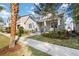 Beautifully landscaped home with a well-maintained lawn and inviting walkway, complemented by mature trees at 7845 Dausset St, Orlando, FL 32827
