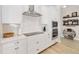 Close up of a modern kitchen featuring stainless steel appliances and white subway tile backsplash at 7845 Dausset St, Orlando, FL 32827