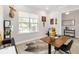 Bright office space with a cowhide rug, modern desk, and a window offering natural light at 7845 Dausset St, Orlando, FL 32827