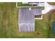 Aerial view of the roof, manicured lawn, and surrounding neighborhood at 820 E Flag Ln, Kissimmee, FL 34759