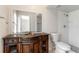 Bathroom features a vanity with decorative carvings and a tiled walk-in shower at 820 E Flag Ln, Kissimmee, FL 34759