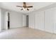 Large bedroom with tile floors, a ceiling fan and a double door closet at 820 E Flag Ln, Kissimmee, FL 34759