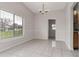 Open dining area has tile flooring, a chandelier and natural light at 820 E Flag Ln, Kissimmee, FL 34759