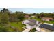 Single story home with gray exterior, attached garage, and large green lawn at 820 E Flag Ln, Kissimmee, FL 34759