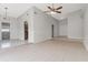 Large open living room featuring tile floors, high ceilings, and lots of light at 820 E Flag Ln, Kissimmee, FL 34759