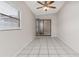 Sun room offers natural light, tile flooring and a sliding glass door leading to the backyard at 820 E Flag Ln, Kissimmee, FL 34759