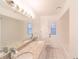 Bright bathroom with double vanity and granite countertops at 820 Rayston, Deltona, FL 32725