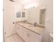 Bright bathroom featuring a double vanity with granite countertop and tiled floor at 820 Rayston, Deltona, FL 32725