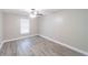 Bright bedroom featuring a ceiling fan, a window, and neutral wall paint at 820 Rayston, Deltona, FL 32725