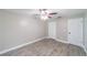 Bright bedroom featuring a ceiling fan, closet, and neutral wall paint at 820 Rayston, Deltona, FL 32725