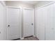 Hallway view showcasing closet and bedroom doors at 820 Rayston, Deltona, FL 32725