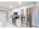 Modern kitchen showcasing stainless steel appliances and white cabinetry at 820 Rayston, Deltona, FL 32725