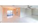Spacious living room with sleek tile flooring and large sliding doors to the pool area at 820 Rayston, Deltona, FL 32725