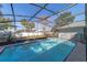 Enjoy the sparkling screened-in pool with blue and white tile and privacy fence, perfect for relaxing and entertaining at 820 Rayston, Deltona, FL 32725