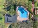 Aerial view of the community pool, showcasing its inviting layout and lush surroundings at 8314 Tangelo Tree Dr, Orlando, FL 32836