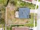 Aerial view of a home showcasing the roof, patio, and fenced backyard at 9518 Lynwood St, Clermont, FL 34711