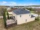 The aerial view reveals a home with a patio, fence, and view of a lake at 9518 Lynwood St, Clermont, FL 34711