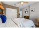 Bedroom with closet, white comforter and natural light at 9518 Lynwood St, Clermont, FL 34711