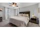 Bedroom with a ceiling fan, neutral walls, and natural light from windows at 9518 Lynwood St, Clermont, FL 34711