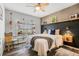 Stylish bedroom featuring dark laminate floors, neutral gray walls and industrial decor at 9518 Lynwood St, Clermont, FL 34711