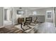 Cozy loft area with wood floors, contemporary seating, a mounted TV, and natural light from a window at 9518 Lynwood St, Clermont, FL 34711