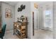 Charming coffee station on a rolling cart, with coffee maker and beverage storage, next to entry to hallway at 9518 Lynwood St, Clermont, FL 34711