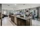Spacious kitchen with modern island opens to living area at 9518 Lynwood St, Clermont, FL 34711