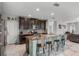 Open-concept kitchen with modern appliances and a spacious island with breakfast bar at 9518 Lynwood St, Clermont, FL 34711