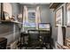 Home office with dual monitors, shelving, and a window with natural light at 9518 Lynwood St, Clermont, FL 34711